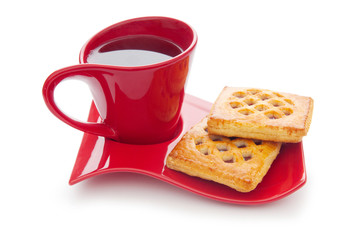 Cup of tea and fresh cookies on table