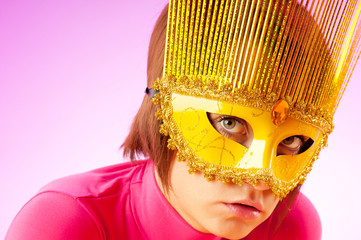 Attractive woman posing in the stylish mask