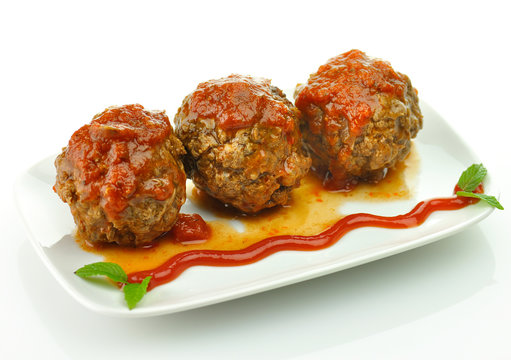 Meat Balls With Tomato Sauce On White Dish