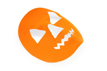 Orange scary halloween mask as holiday concept