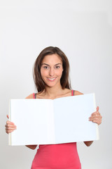 Smiling woman showing message sign