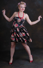 Happy young female in curlers and prom dress © Warren Millar
