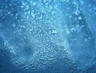 Natural winter background - ice on pane