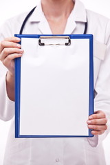 Doctor holds clipboard with empty sheet. Isolated on a white.