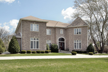 Obraz premium Luxury brick home with side garage