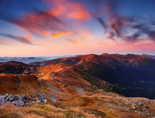 Fototapeta premium Landscape with a dawn in mountains