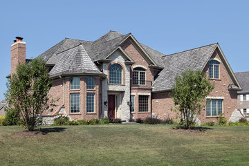 Brick home with front balcony