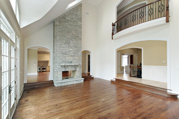 Family room with two story fireplace