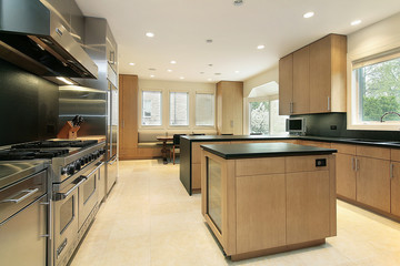 Kitchen with black counters