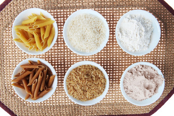 Fototapeta na wymiar Whole Wheat, Brown vs White Pasta, Rice and Flour