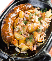 Fried potatoes with grilled sausages
