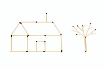 Stick matches house and one tree isolated on white