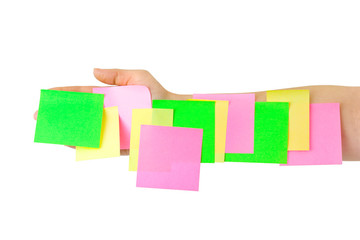 Hand and multicolored note paper