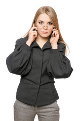 Portrait of serious young blonde in a gray business suit