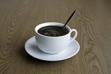 cup of coffee on the table surface