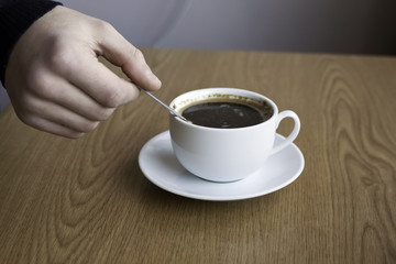 cup of coffee on the table surface