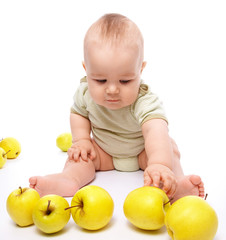 Fototapeta na wymiar Little boy play with apples