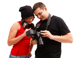 Photographer and model looking at photos