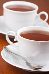 Two cups of tea with saucers
