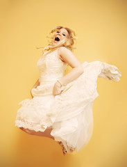 Happy bride jumping