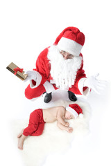 Santa is giving gift to sleeping baby