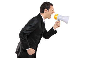 Angry businessman shouting via megaphone