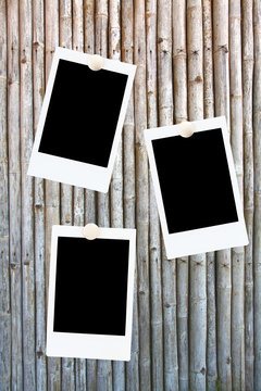 blank polaroids frames on a bamboo background
