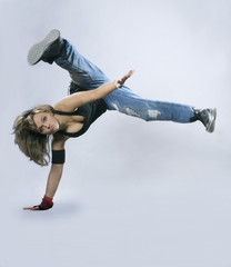Teenage girl dancing breakdance in action