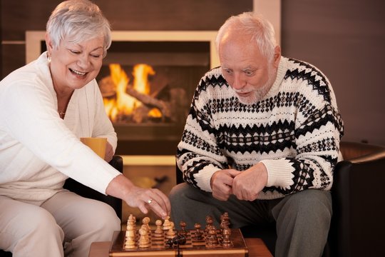 Senior couple having fun with chess