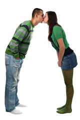 Kissing young couple isolated on white