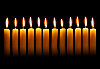 Twelve alight candles