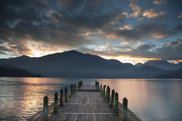 Sunrise over mountain and Looking over a pier