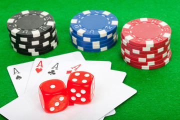 winning poker hand of four aces playing cards and chips