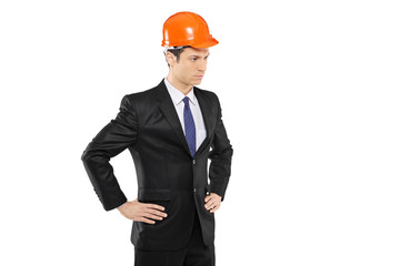 An architect in a black suit standing