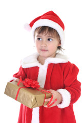 Little girl in santa clothes with gift