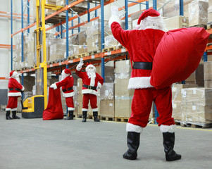 Santa Claus ready for Christmas leaving storehouse