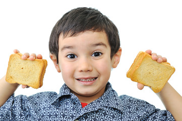 Little boy showing satisfaction with  a peanut butter sandwich