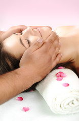 young woman receiving head massage