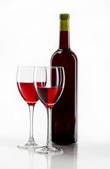 Glass of red wine and a bottle