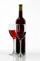 bottle with red wine and glass