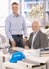 Portrait of senior and junior businessmen