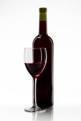 bottle with red wine and glass