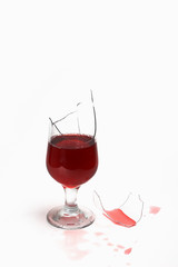 broken glass with wine and drops