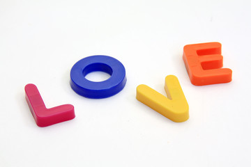 Word LOVE made from Plastic isolated over white background