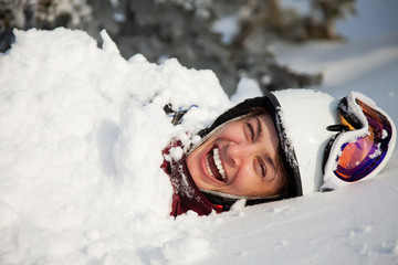 A funny lifestyle image of young adult snowboarder