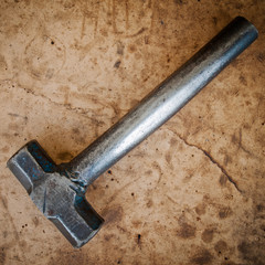hammer on dirty wood