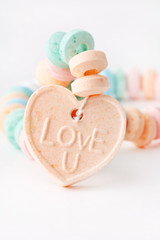 Fototapeta na wymiar Candy necklace with Love U on it