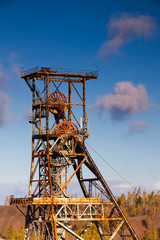 Fototapeta na wymiar Old industry-Coal Mine and autumn forest