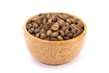 Black coffee beans in wood cup on white background