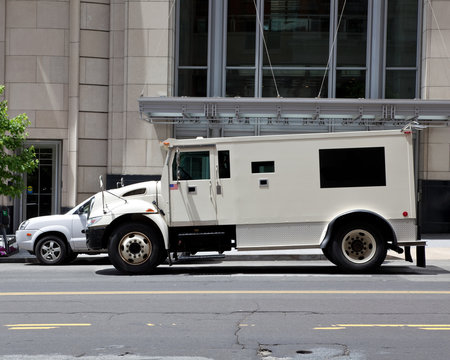 Side View Armoured Armored Car Parked on Street Outside Building